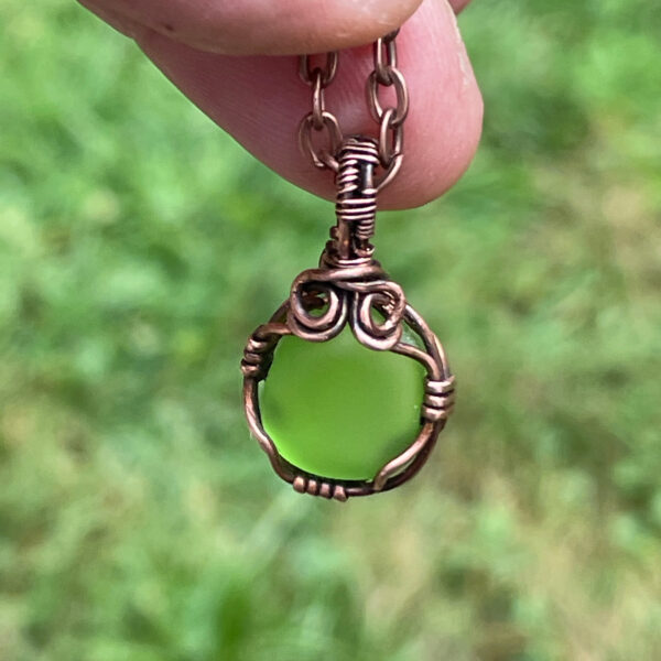 Pendant-A tiny light green sea glass wrapped with copper wire