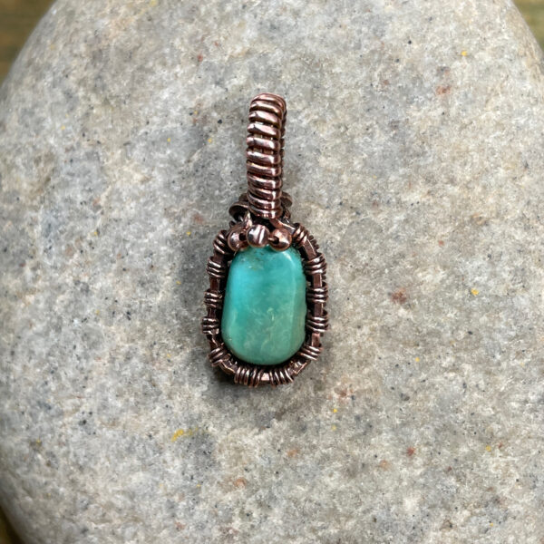 Small natural turquoise and woven copper wire pendant