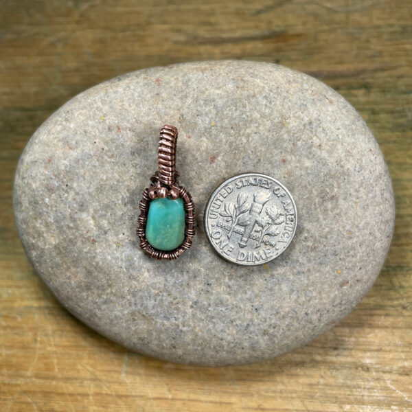 Small natural turquoise and woven copper wire pendant