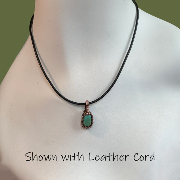 Small natural turquoise and woven copper wire pendant