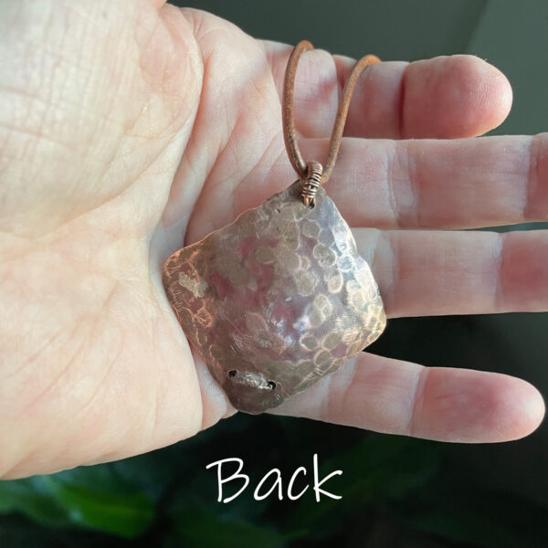 Pendant-A White Howlite cabochon wrapped with woven copper wire in a hammered copper frame